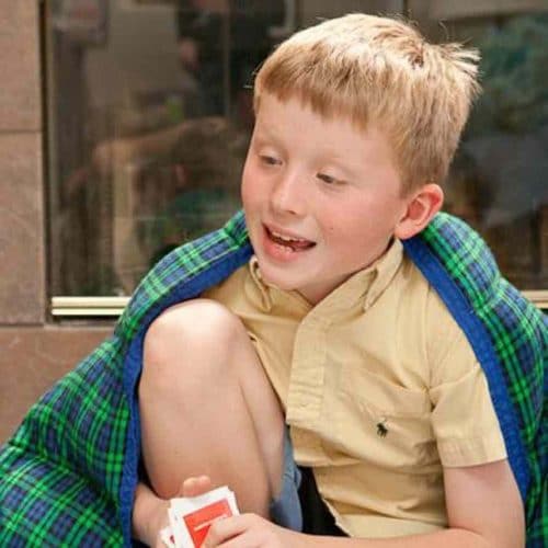 Picture of a Child with Autism Wearing a Weighted Blanket