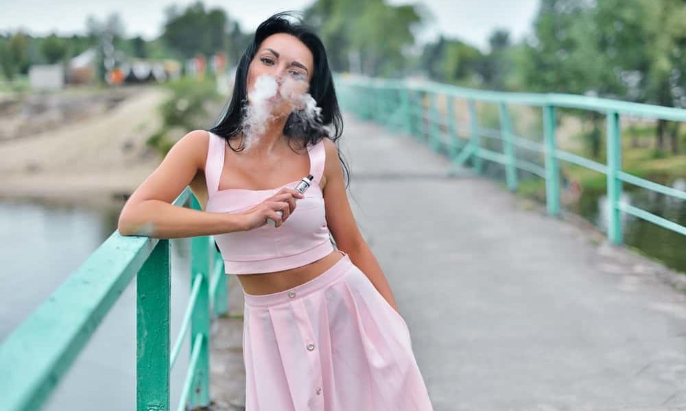 Picture of a woman using a vaporizer