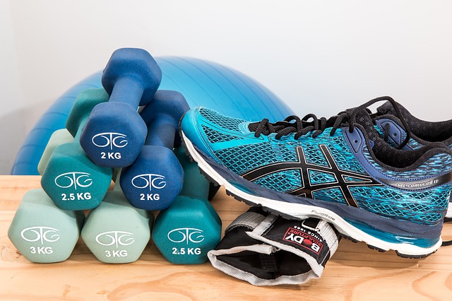 Picture of strength training equipment and running shoes