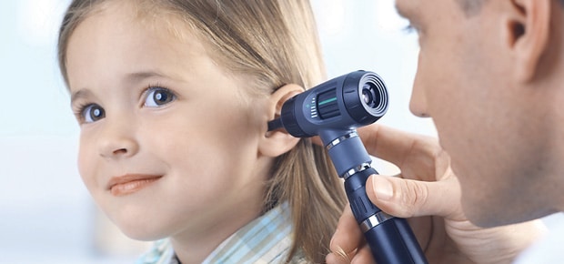Picture of a doctor using an otoscope to diagnose ear infections in a child