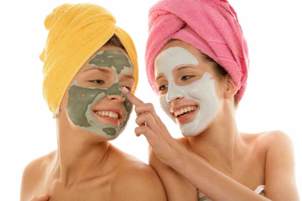 Two women wearing facial masks