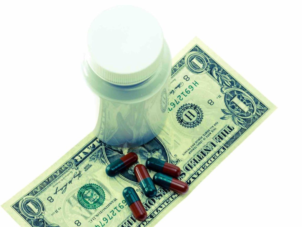 Medicine and dollar bill