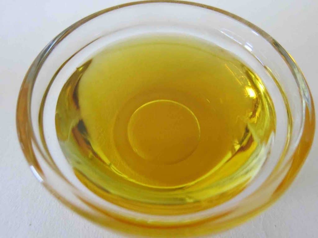 Close-up photo of a small bowl of CBD oil