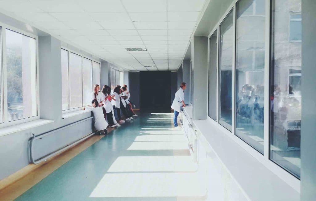 Hospital employees walking in the hall