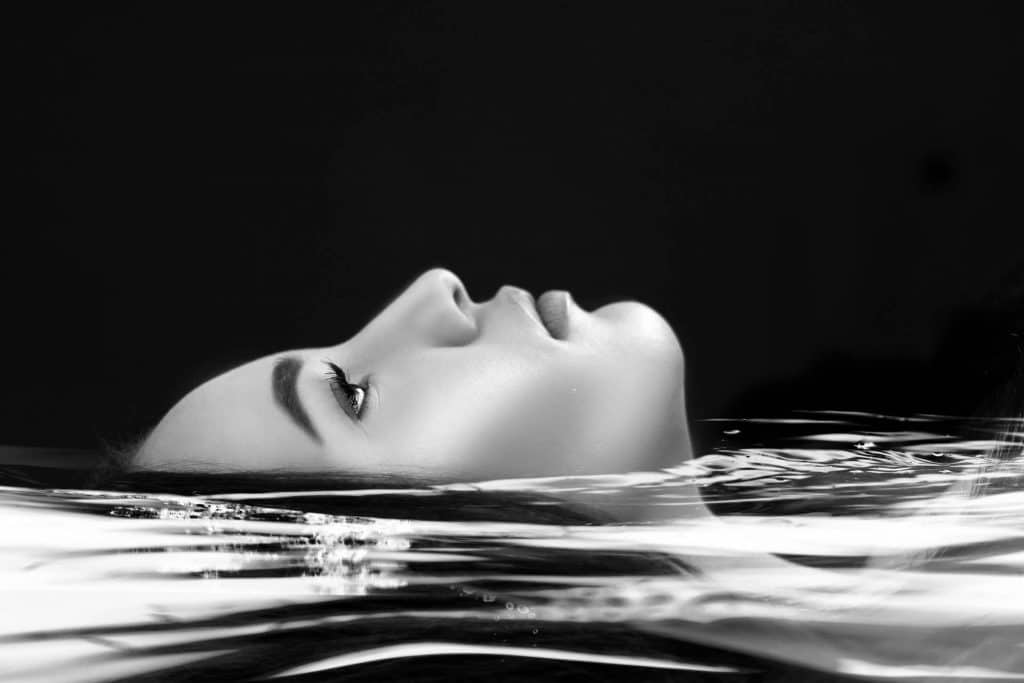 Woman's face above water level
