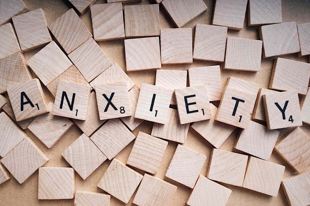 Board game squares spelling out "anxiety"