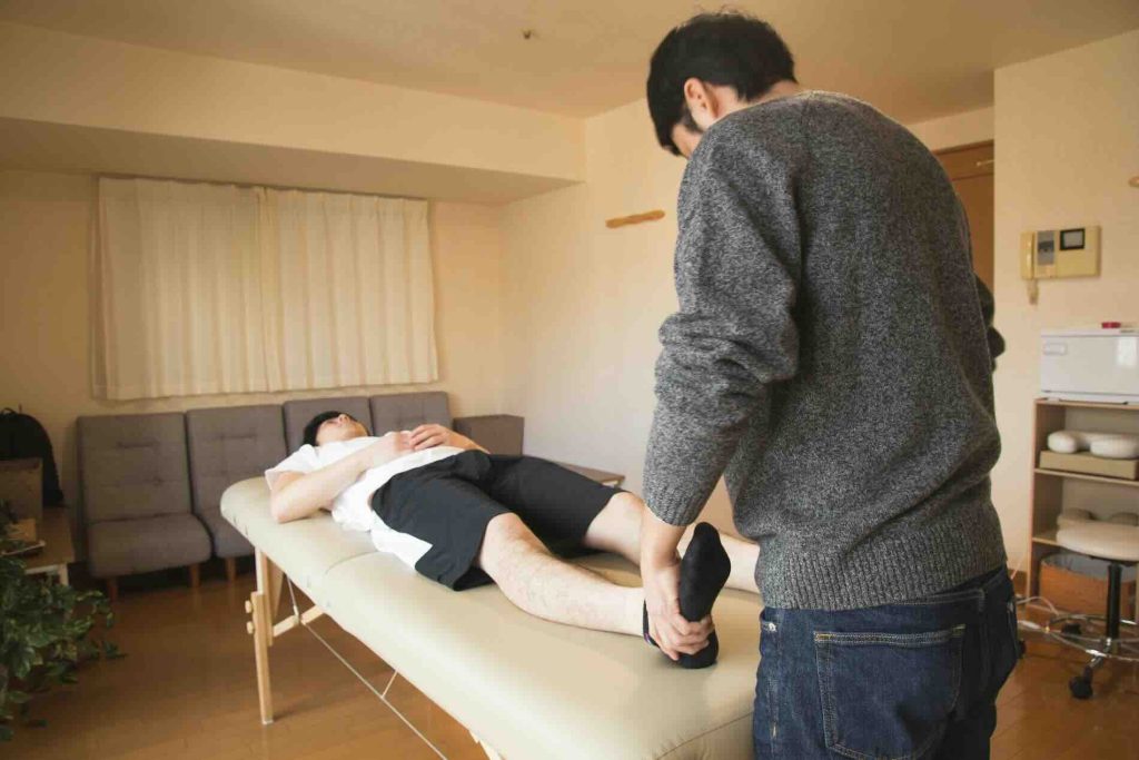 Physiotherapist working with a patient