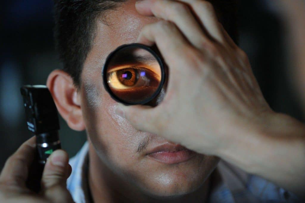 Man getting an eye exam from an optometrist