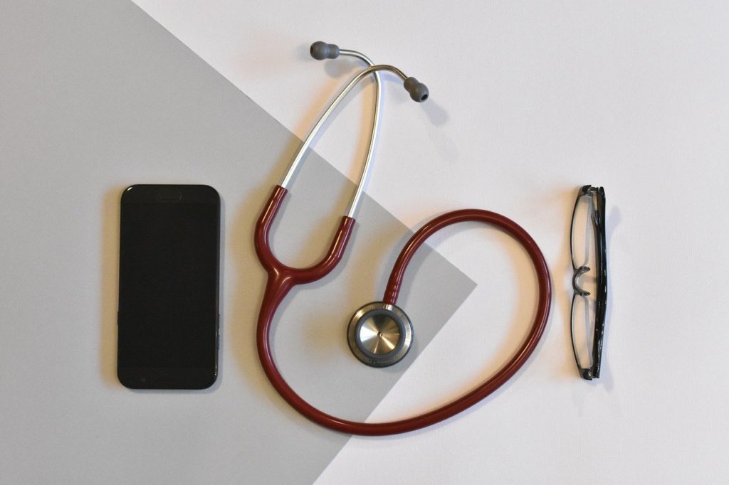 Stethoscope, smartphone, and glasses