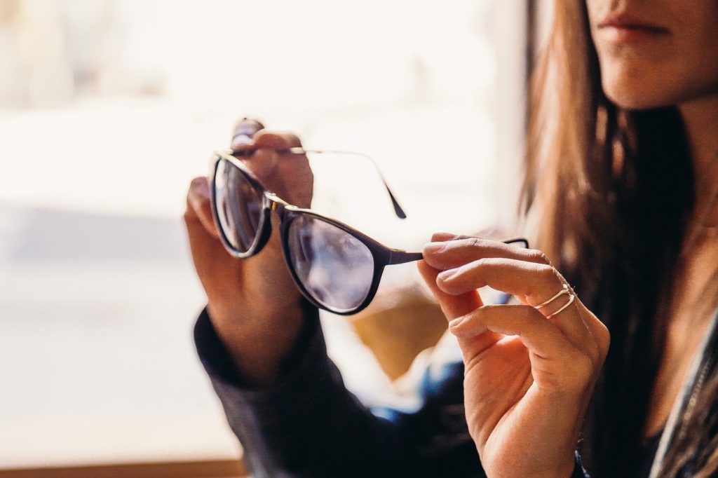 Woman looking at eyeglasses