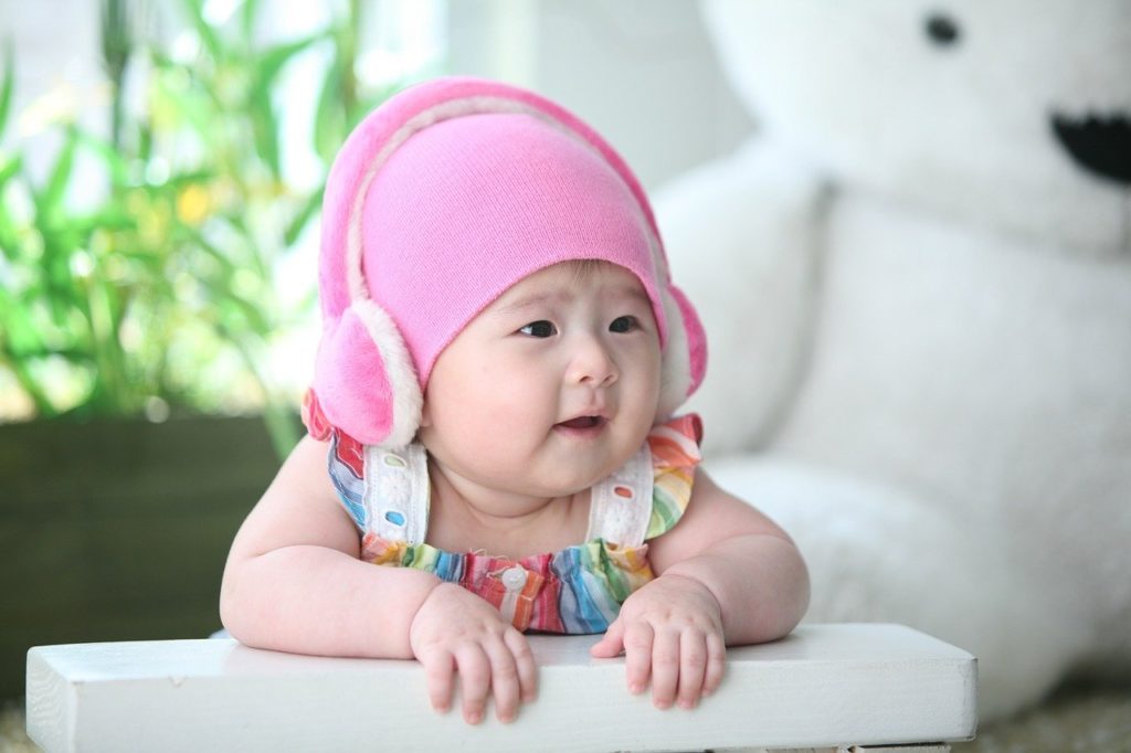 Infant wearing fuzzy earmuffs