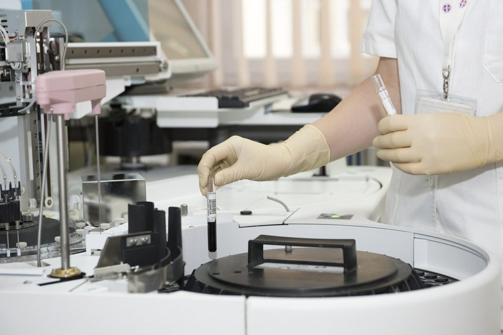 Researcher working at a PCR machine