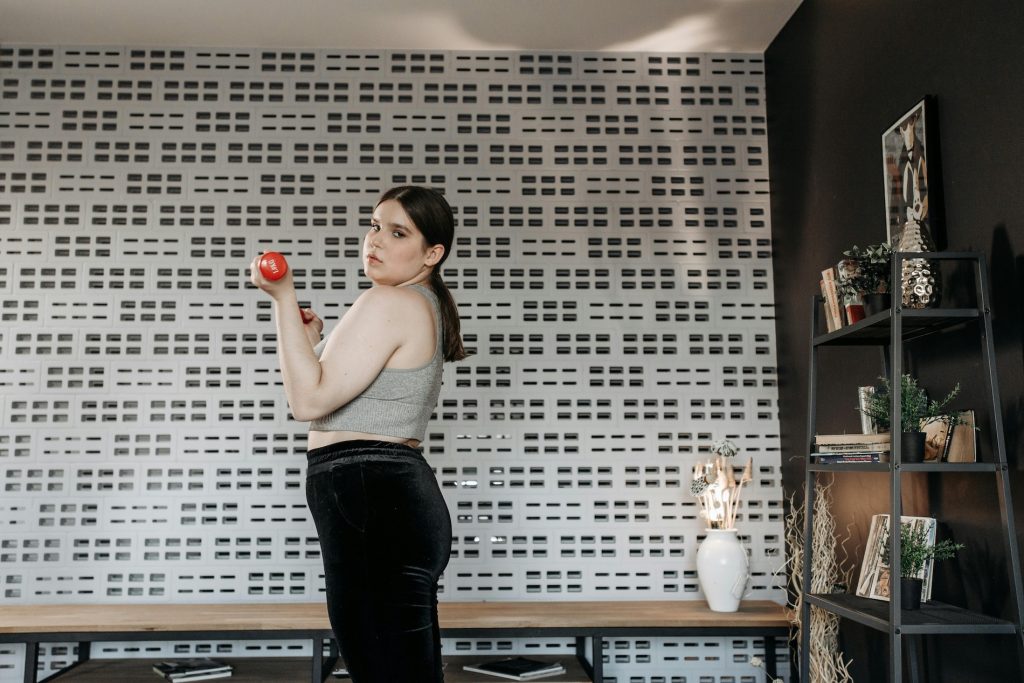 Woman doing exercises in her home