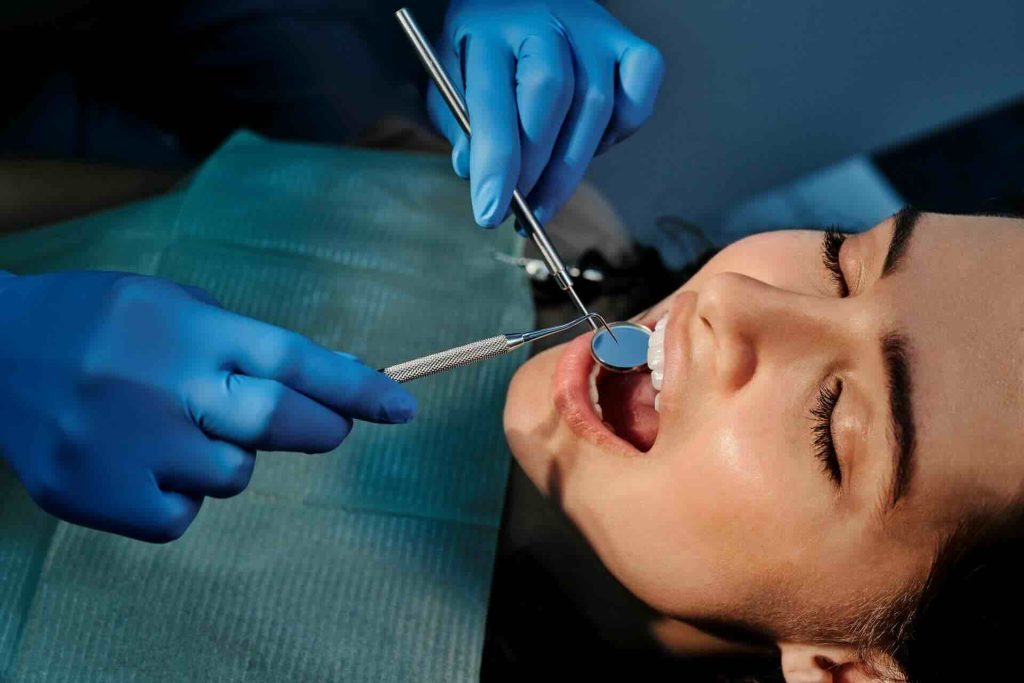 Woman in a dentist's office getting an examination of her teeth