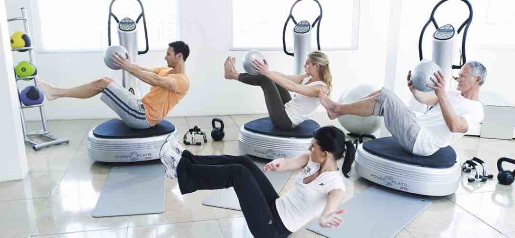 Group exercising using vibration plate machines